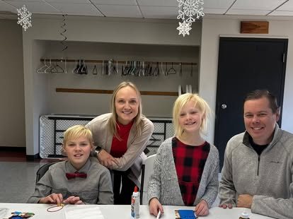 Families making crafts together at a New Bethel event