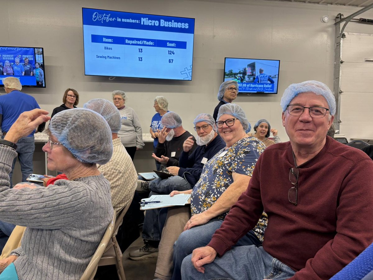 Volunteers packing meals for neighbors in need