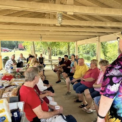 New Bethel members sharing a meal together outdoors
